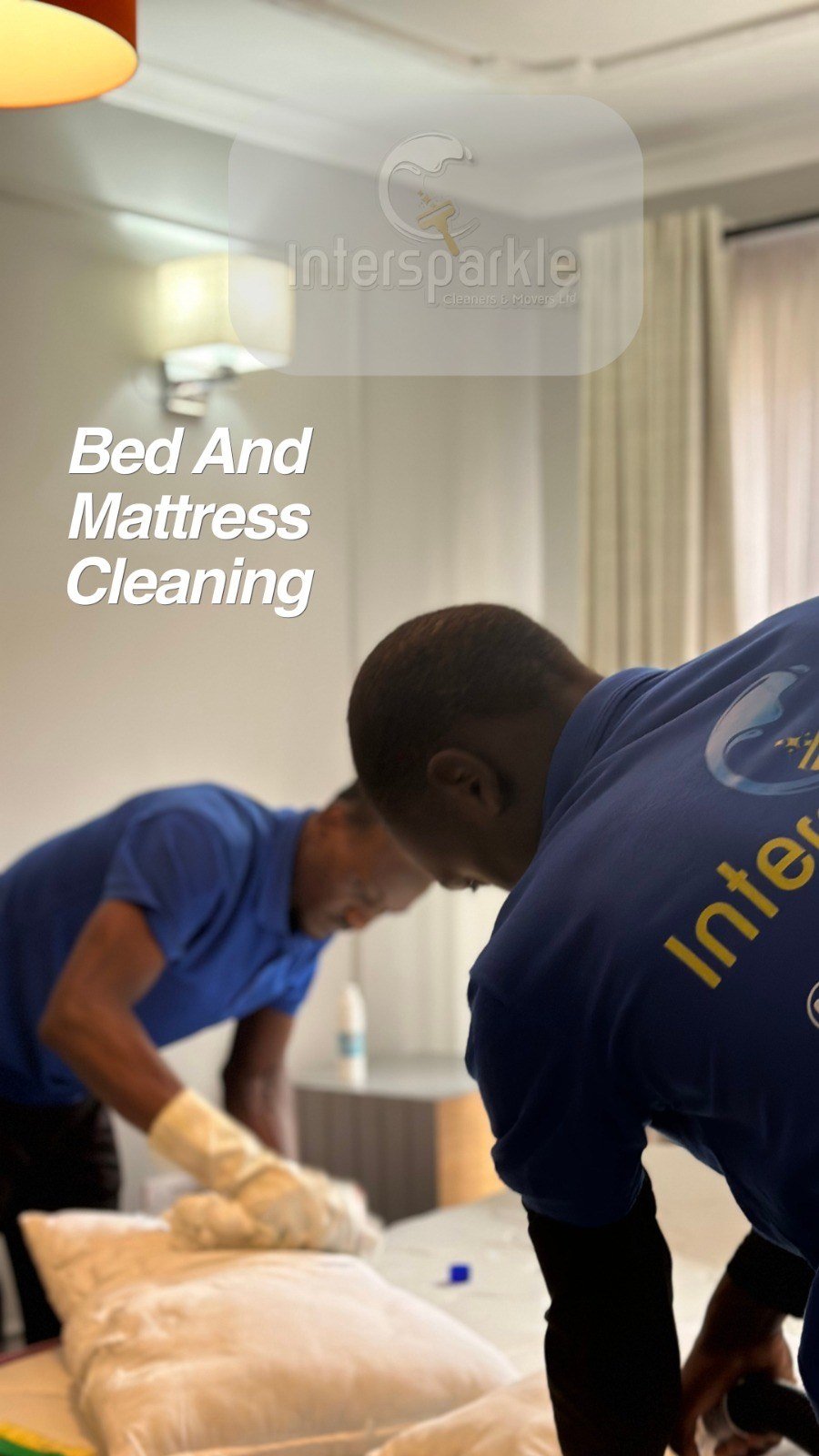 Cleaners working on a bed and mattress