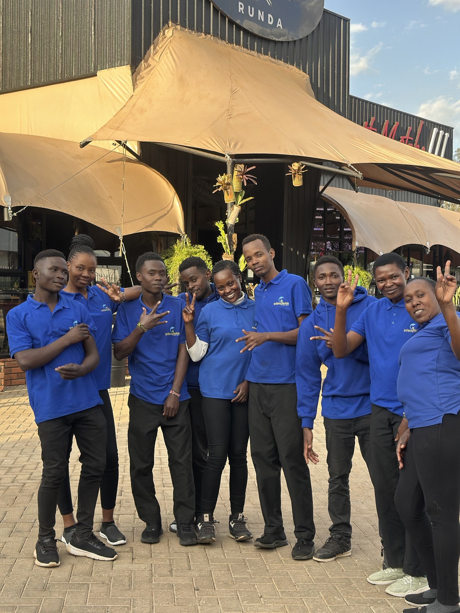 The Intersparkle team in blue uniforms